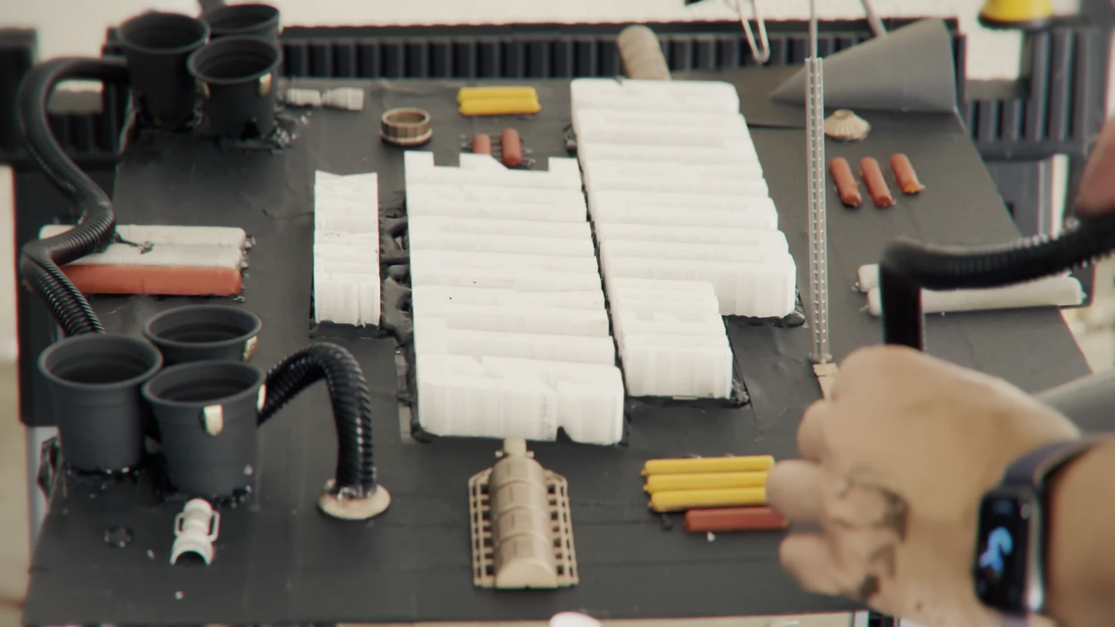 Burt fabricating the tabletop space-engine miniature.